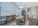 Spacious dining area with a rustic wooden table and coordinating chairs at 9609 Brookdale Dr, New Port Richey, FL 34655