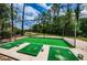 Covered driving range with multiple mats and ball baskets at 9609 Brookdale Dr, New Port Richey, FL 34655