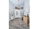 Bright and airy entryway with wood-look floors and decorative furniture at 9609 Brookdale Dr, New Port Richey, FL 34655
