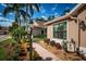 Landscaped walkway leading to a house at 9609 Brookdale Dr, New Port Richey, FL 34655