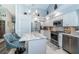 Modern kitchen with a large island, granite countertops, and stainless steel appliances at 9609 Brookdale Dr, New Port Richey, FL 34655