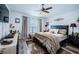 Serene main bedroom with a king-size bed and large window at 9609 Brookdale Dr, New Port Richey, FL 34655