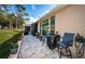 Relaxing patio with brick pavers, seating, and golf course views at 9609 Brookdale Dr, New Port Richey, FL 34655