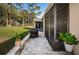 Spacious paved patio with grill and screened enclosure at 9609 Brookdale Dr, New Port Richey, FL 34655