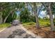 Scenic walking path with a wooden bridge at 9609 Brookdale Dr, New Port Richey, FL 34655