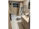 Clean bathroom with bathtub, toilet and vanity at 1050 Tamarac Dr, Holiday, FL 34690
