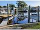 Private boat docks with multiple slips and waterfront access at 1050 Tamarac Dr, Holiday, FL 34690