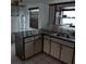 Corner kitchen with stainless steel appliances at 1050 Tamarac Dr, Holiday, FL 34690