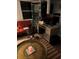 Cozy living room with red couch and work desk at 1050 Tamarac Dr, Holiday, FL 34690