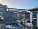 Above-ground pool with a screened enclosure at 1050 Tamarac Dr, Holiday, FL 34690