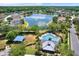 Community pool and playground with lake view at 10724 Burning Bush Ter, Land O Lakes, FL 34638
