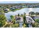 Two story house on the lake in a residential area at 10724 Burning Bush Ter, Land O Lakes, FL 34638