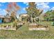 Backyard with raised garden beds and patio at 10724 Burning Bush Ter, Land O Lakes, FL 34638