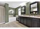 Large bathroom with double vanity, soaking tub, and neutral colors at 10724 Burning Bush Ter, Land O Lakes, FL 34638
