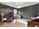 Cozy bedroom with a desk and a leather couch at 10724 Burning Bush Ter, Land O Lakes, FL 34638