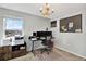 Home office boasts a large desk, dual monitors, and a bulletin board at 10724 Burning Bush Ter, Land O Lakes, FL 34638