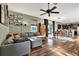 Open living space with L-shaped sofa, dining area, and kitchen view at 10724 Burning Bush Ter, Land O Lakes, FL 34638