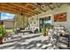 Relaxing covered patio with outdoor seating and a grilling area at 10724 Burning Bush Ter, Land O Lakes, FL 34638