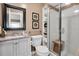 Clean bathroom with shower and shelving at 11617 Boynton Ln, New Port Richey, FL 34654