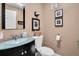 Clean bathroom with a glass vanity and neutral color scheme at 11617 Boynton Ln, New Port Richey, FL 34654
