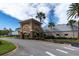 Community building with arched entryway and landscaping at 11617 Boynton Ln, New Port Richey, FL 34654