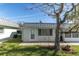 Single story home with metal roof and lawn at 11617 Boynton Ln, New Port Richey, FL 34654