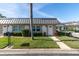 Front view of home with metal roof and lawn at 11617 Boynton Ln, New Port Richey, FL 34654