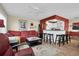 Open concept living and kitchen area with a breakfast bar and hardwood floors at 11617 Boynton Ln, New Port Richey, FL 34654
