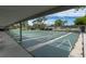 Community shuffleboard courts under covered area at 11617 Boynton Ln, New Port Richey, FL 34654