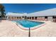 Community swimming pool with lounge chairs at 11617 Boynton Ln, New Port Richey, FL 34654