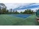 Two tennis courts with green and blue surface at 11617 Boynton Ln, New Port Richey, FL 34654