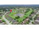 Aerial view of house near golf course and pond at 13455 Niti Dr, Hudson, FL 34669