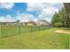 Spacious backyard with a privacy fence and views of neighboring homes at 13455 Niti Dr, Hudson, FL 34669