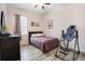 Spacious bedroom with wood-like floors and ceiling fan at 13455 Niti Dr, Hudson, FL 34669