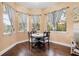 Bright breakfast nook with a round table and three chairs at 13455 Niti Dr, Hudson, FL 34669