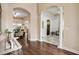 Bright and spacious entryway with hardwood floors and arches at 13455 Niti Dr, Hudson, FL 34669