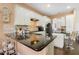 Modern kitchen with granite countertops and stainless steel appliances at 13455 Niti Dr, Hudson, FL 34669
