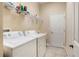 Convenient laundry room with washer, dryer, and overhead shelving at 13455 Niti Dr, Hudson, FL 34669