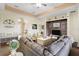 Comfortable living room with hardwood floors and built-in shelving at 13455 Niti Dr, Hudson, FL 34669