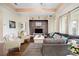 Spacious living room with hardwood floors, large windows and comfortable seating at 13455 Niti Dr, Hudson, FL 34669