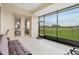 Relaxing screened porch overlooking a lush golf course at 13455 Niti Dr, Hudson, FL 34669