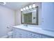 Bathroom with white cabinets and marble countertop at 13541 Stacey Dr, Hudson, FL 34667