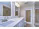 Double vanity bathroom with marble countertops at 13541 Stacey Dr, Hudson, FL 34667