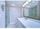 Bathroom features a marble countertop and glass shower at 13541 Stacey Dr, Hudson, FL 34667