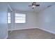 Bedroom with mirrored closet doors and tile flooring at 13541 Stacey Dr, Hudson, FL 34667