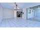 Bright dining room with tile floors and access to kitchen at 13541 Stacey Dr, Hudson, FL 34667