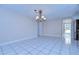 Spacious dining room with tile flooring and access to the backyard at 13541 Stacey Dr, Hudson, FL 34667