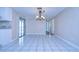 Bright dining room with tile flooring and a chandelier at 13541 Stacey Dr, Hudson, FL 34667