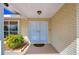 White double front doors with sidelights and a decorative doormat at 13541 Stacey Dr, Hudson, FL 34667