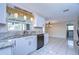 White kitchen with granite countertops and stainless steel appliances at 13541 Stacey Dr, Hudson, FL 34667